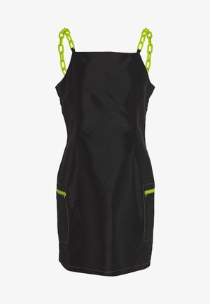 Black dress made of a smooth fabric with a fitted silhouette, featuring neon green chain straps and zippered pockets with matching accents.