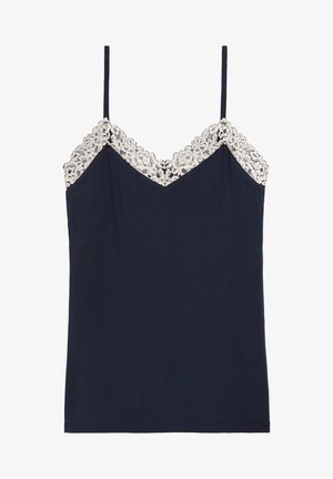 Marinblå camisole med justerbara spagettiband och en vågig krämfärgad spetskant längs V-ringningen. Mjuk tygkvalitet, avslappnad passform och utan mönster.