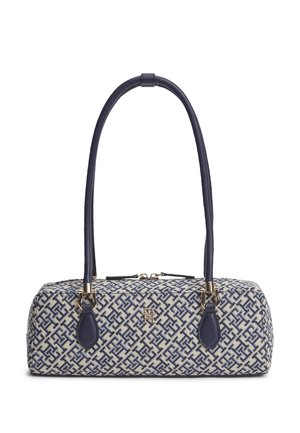 Prostokątny damski torebka z granatowo-białym geometrycznym wzorem, złotym logo i długimi granatowymi skórzanymi rączkami, zamykana na zamek od góry.