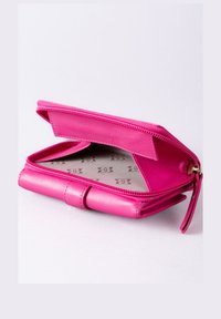 Pink leather wallet with a zip closure; features a smooth texture, multiple compartments, and a patterned interior lining.