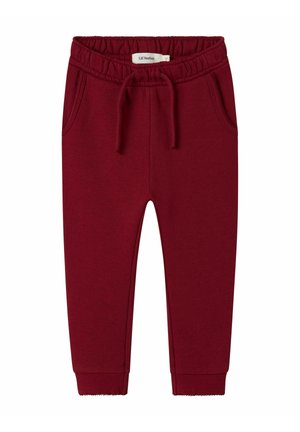 Pantaloni tuta color borgogna realizzati in tessuto morbido, dotati di una vita elastica con coulisse, tasche laterali e polsini a coste.