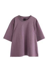 Lilla bomulds T-shirt med rund halsudskæring, korte ærmer og en afslappet pasform. Glat tekstur med minimal detaljer og uden synlige logoer.