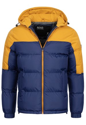 Wattierte Jacke mit einem dunkelblauen Körper und einem gelben oberen Teil. Enthält eine Kapuze, einen Reißverschluss und seitliche Taschen mit elastischen Bündchen.