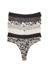 Ensemble de cinq strings pour femmes en noir et crème, avec des motifs floraux, des bords en dentelle et des ceintures contrastées. Texture de tissu douce.