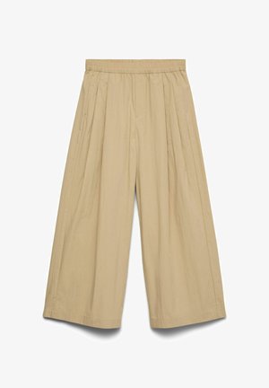 Bézs színű, széles szárú, rövidített nadrág, elasztikus derékpánttal és oldalzsebekkel, könnyű anyagból készült.