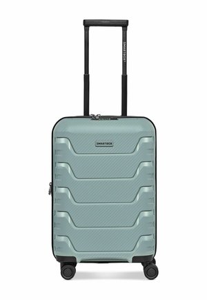Hellgrüner Hartschalenkoffer mit vier Drehrollen, ausziehbarem schwarzem Griff und Smartbox-Logo auf der Vorderseite.