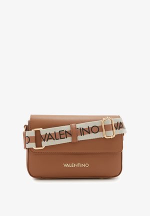 Brown leather crossbody bag with flap closure, branded strap in beige and brown, gold hardware, and smooth texture.