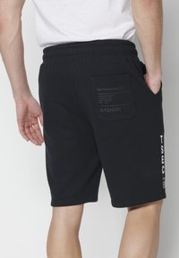 Koroshi BERMUDA JOGGER - Kratke hlače - black