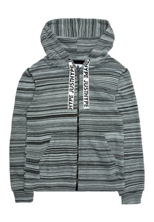 Sweat à capuche zippé rayé gris et noir avec poches avant et cordons blancs imprimés du mot "JUSTHYPE" en lettres noires.