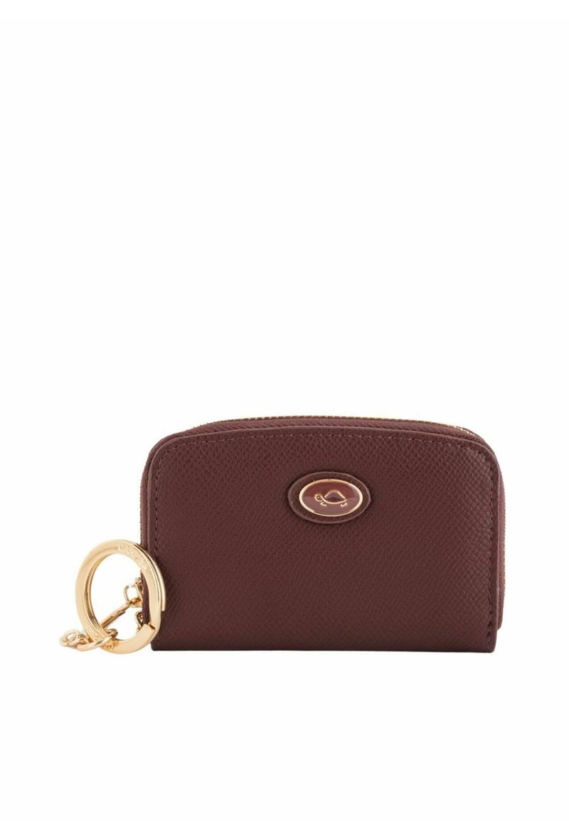 Brown leather wallet with textured surface, gold hardware ring, and logo accent. Zipper closure at the top, compact rectangular shape.