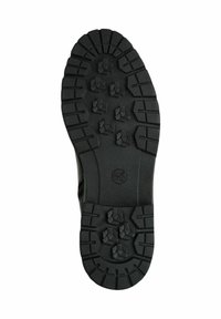 Semelle de chaussure en caoutchouc noir avec un motif de semelle texturé, comportant des crampons hexagonaux pour la traction et un talon plat pour la stabilité.