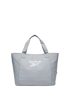 Světle šedá taška Reebok s dvěma krátkými uchy a velkým centrálním logem na přední straně.