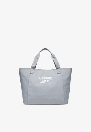 Bolso tote Reebok gris claro con dos asas cortas y un gran logo central en el frente.