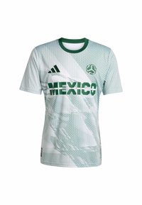 Zelena i bijela nogometna majica kratkih rukava s gradijentnim uzorkom, "MEXIKO" u podebljanim zelenim slovima, i Adidas logo na lijevom ramenu.