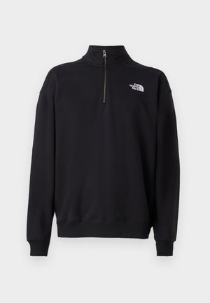 Sort half-zip sweatshirt lavet af blødt stof, med en høj krave, ribbede manchetter og et hvidt logo på venstre bryst.