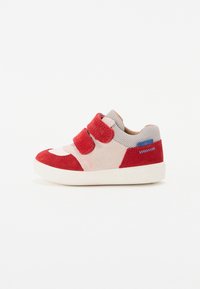 Red and beige velcro shoes with a textured suede finish, featuring a mesh tongue and contrasting blue accent, set on a white rubber sole.