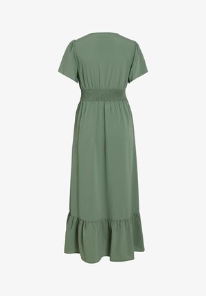 Rochie midi verde deschis cu mâneci scurte, talie elastică și tiv cu volane, prezentată din spate pe un fundal alb.