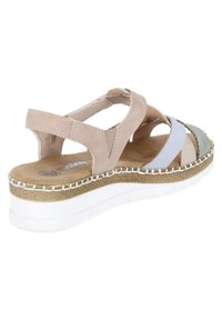 Beige wedge sandal with ankle strap, light blue and green front straps, textured sole, and white stitched midsole detail.