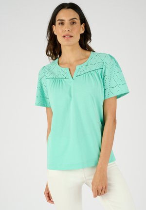 Korte mouwen top in mintgroene katoen met gaatjespatronen op de schouders, voorzien van een V-hals en een relaxte pasvorm.