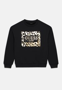 Černá mikina se zvířecím vzorem leopardího tisku a zlatými akcenty, s výrazným nápisem "GUESS". Klasický design s kulatým výstřihem.