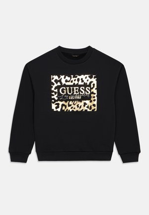 Černá mikina se zvířecím vzorem leopardího tisku a zlatými akcenty, s výrazným nápisem "GUESS". Klasický design s kulatým výstřihem.