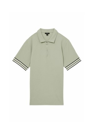 Svetlozelená polo košeľa s krátkymi rukávmi, textúrovaná tkanina, predný zips a čierno-biele pruhované akcenty na rukávoch.