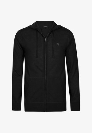 Black zip-up hoodie made from soft material. Features a thin, adjustable hood, front pockets, and a small logo on the chest.