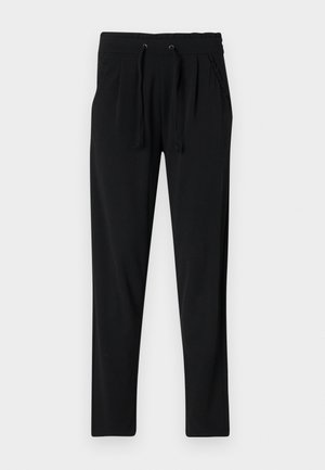 Sorte joggebukser laget av myk stoff, med elastisk midje og snøring, sidelommer og smalnet bendesign.