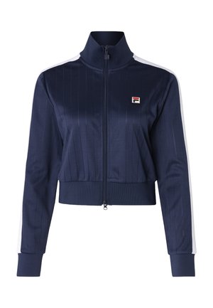 Giacca cropped blu navy con zip, caratterizzata da righe verticali, colletto alto e strisce bianche accentate sulle maniche. Presenta un piccolo logo sul petto.