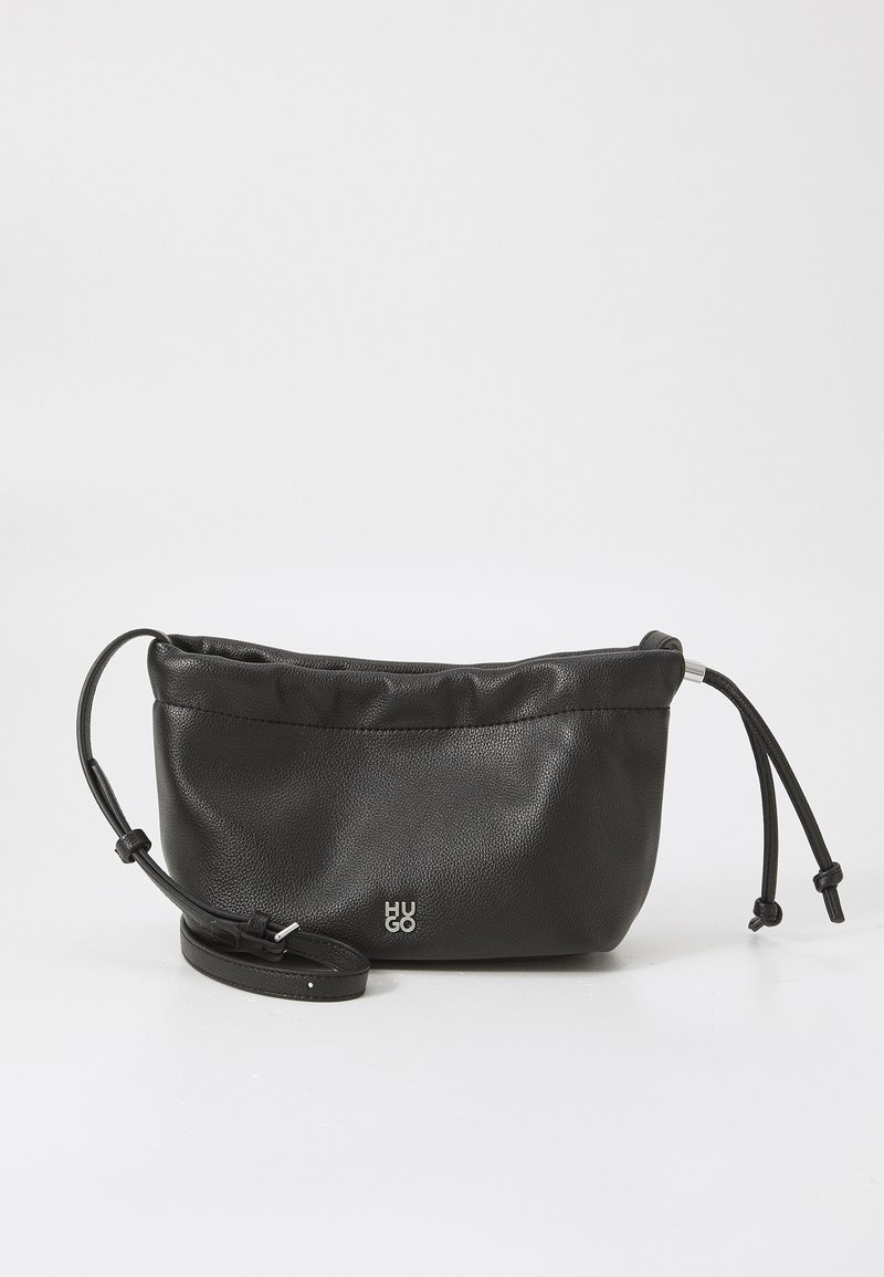 Black leather bag with a soft texture, cinched top, and adjustable strap. Features a small silver logo on the front.