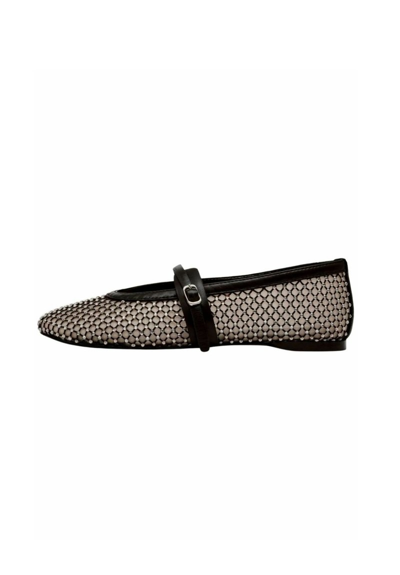 Black and white flat shoe with mesh fabric featuring a patterned design, rounded toe, and a black strap across the instep with a metal buckle.