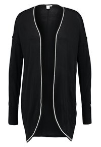 Černý svetr na zapínání s volným střihem, otevřeným předním dílem a kontrastním bílým lemováním podél okrajů. Manžety s žebrovaným vzorem a lehká pletená textura.