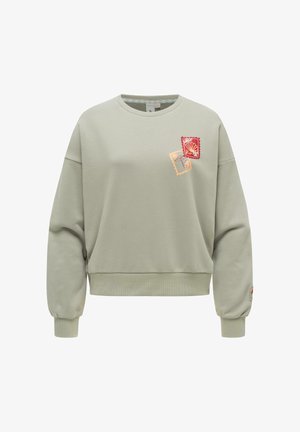 Lysegrøn sweatshirt med to små stempelmotiver nær venstre bryst, der viser en rød skal og et beige blomsterdesign.