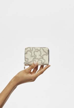 Small, rectangular wallet in textured cream material with a grey abstract pattern and a zipper closure. Accented with a small logo detail.