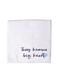 White blanket featuring the text "tiny human big heart" in dark blue with a light blue heart accent. Soft texture with a simple design.