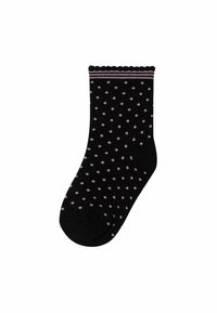 Chaussettes noires avec de petits pois roses, présentant un bord supérieur festonné et un léger accent rayé près de la cheville. Tissu doux et texturé.