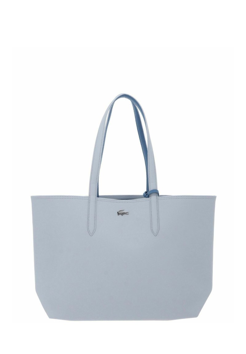 Hellblauer Ledertasche mit zwei Griffen und einem kleinen silbernen Logoemblem oben in der Mitte.