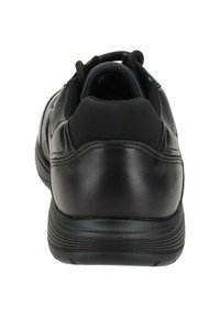 Sneaker nera con una toma in pelle testurizzata, collo imbottito e suola in gomma flessibile con battistrada pronunciato.