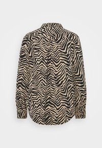 Chemise à manches longues avec motif zèbre noir et beige, dotée d'un col classique et de poignets boutonnés, vue de dos.