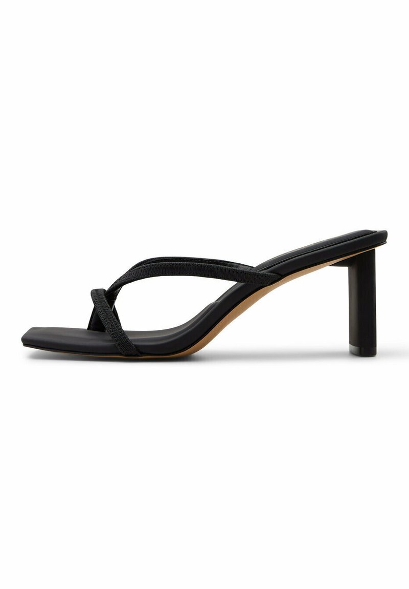 Black heeled sandal featuring a minimalist design with a smooth strap, square toe, and a chunky block heel for stability.