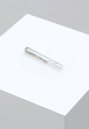 Silver tie clip with a sleek, elongated design, featuring a twisted pattern along one side and a smooth, polished surface.