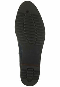 Suola di scarpa in gomma nera con motivo di grip testurizzato, caratterizzata da una punta arrotondata e una sezione scanalata vicino al tallone, taglia contrassegnata come 37.