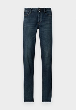 Dark blue denim jeans with a slim fit, featuring a five-pocket design, metal button closure, and subtle faded texture along the legs.