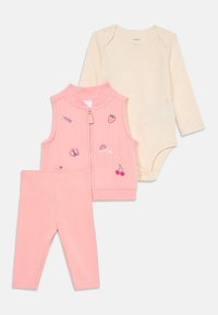 Cream long-sleeve baby bodysuit with pink dots, pink sleeveless zip vest with embroidered motifs, and pink leggings.