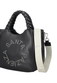 Borsa a mano in pelle nera con manici intrecciati, arricchita da borchie d'argento disposte a cerchio. Include una tracolla removibile grigio chiaro con marchio.