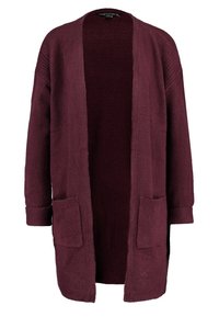 Burgundy kofta i mjukt tyg, med löst passform, öppen front och två framfickor. Slät textur med subtila ribbade detaljer.