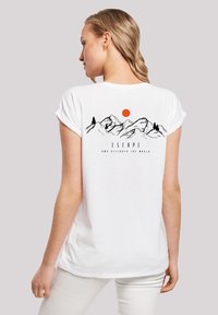 White short-sleeve t-shirt featuring black mountain and tree graphics, with a red sun and the word "ESCAPE" below the design.