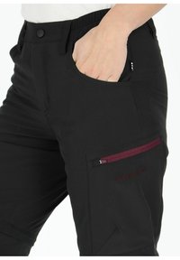 Black pants made of lightweight fabric with an elastic waistband, featuring a side pocket with a maroon zipper and embroidered branding.
