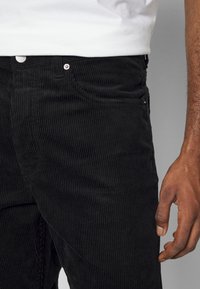Dr.Denim DASH - Calças de ganga de perna direita - black cord