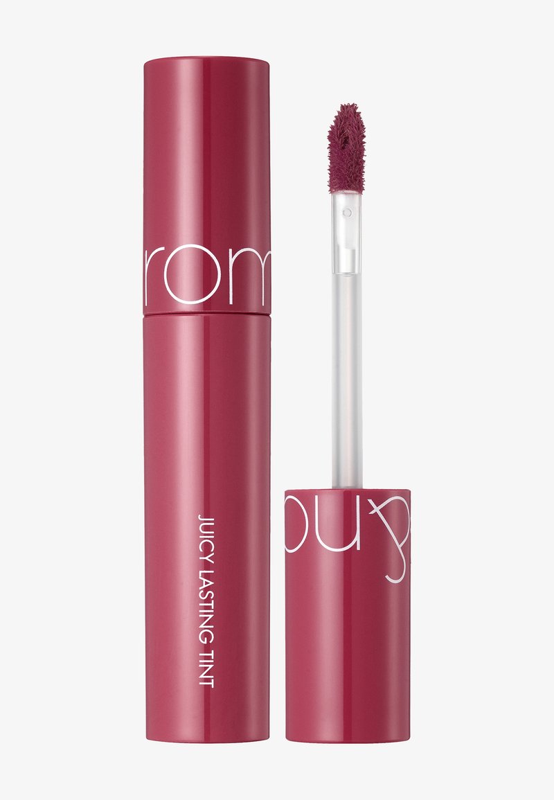 Putki huulimeikki punertavassa vaaleanpunaisessa sävyssä, kiiltävällä pinnalla. Kirkas applikaattori, jossa on pehmustettu pää helppoa levittämistä varten. Tunnuksessa lukee "Mehukas kestävä tintti."